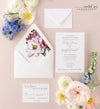 whimsical invitation suite with magnolia envelope liner
