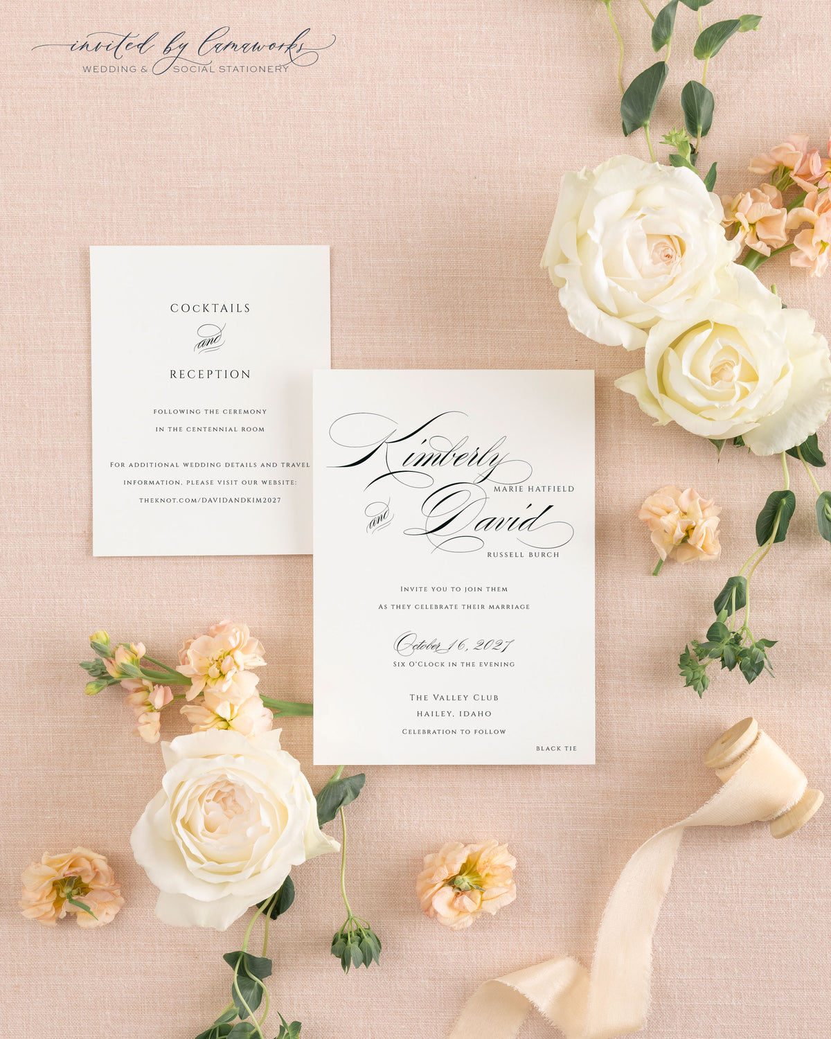 Cream wedding invitation envelope with hand-calligraphed return address next to the Kim - Classic Calligraphy invitation card