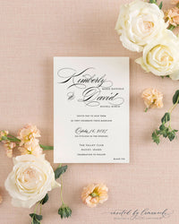Close-up of the Kim - Classic Calligraphy wedding invitation featuring elegant black script and a black tie designation