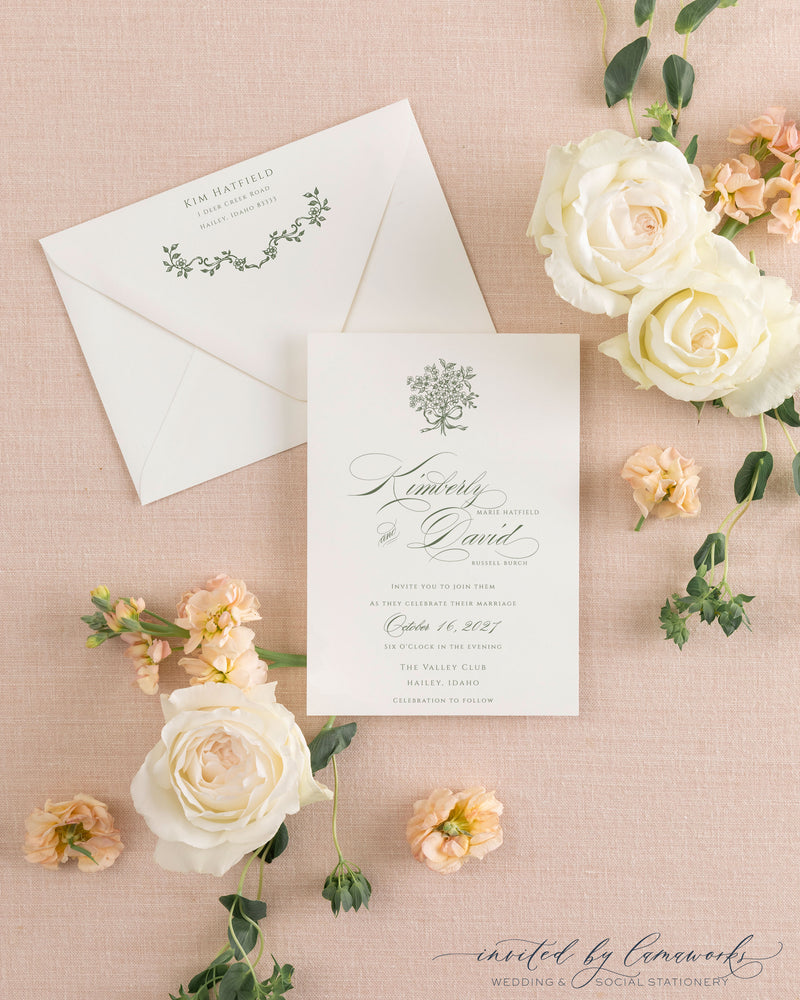 Cream envelope with a hand-calligraphed return address next to the Kim wedding invitation suite invitation card