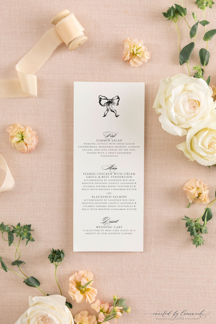 The Kim collection wedding menu card featuring a hand-illustrated bow, calligraphy course headers, and clean serif menu details, styled with ribbon and garden roses