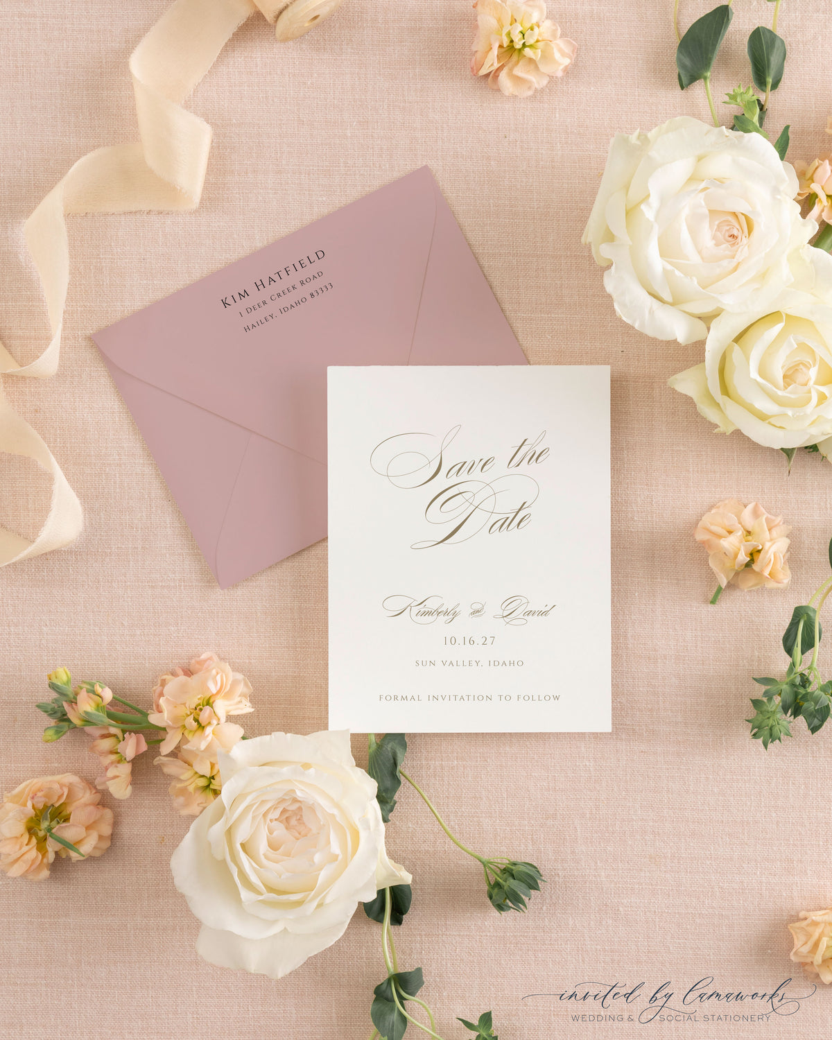 The Kim collection calligraphy save the date card in gold ink, paired with a matching mauve envelope