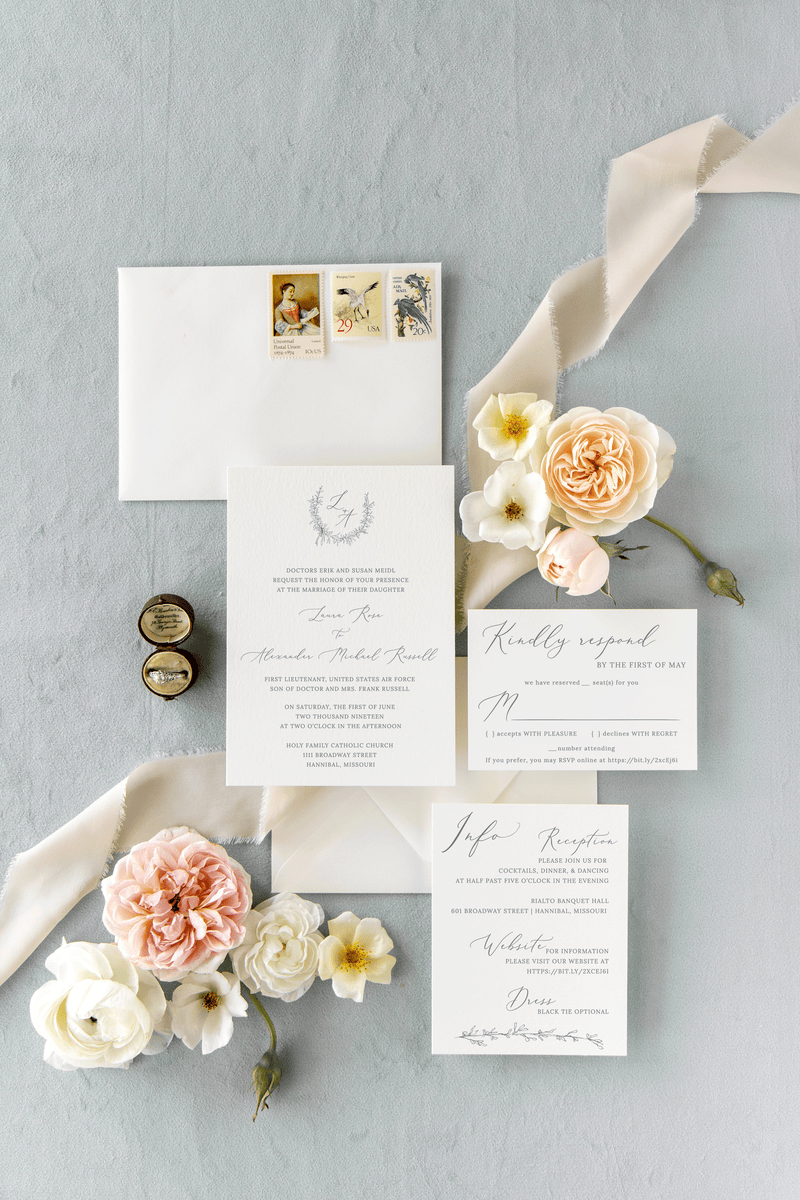 Formal, black tie wedding invitation suite with an elegant wreath and monogram