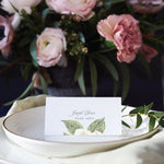 white rose floral escort card or place card